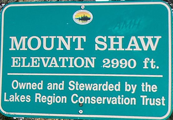 hike mount shaw elevation 2990 feet lakes region conservation trust castle in the clouds trail sign summit